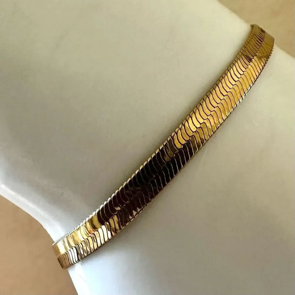 Gold tone flat herringbone bracelet